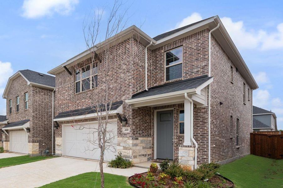 Front exterior of a new home in Spiritas Ranch, Little Elm, TX, highlighting curb appeal (Image 22).