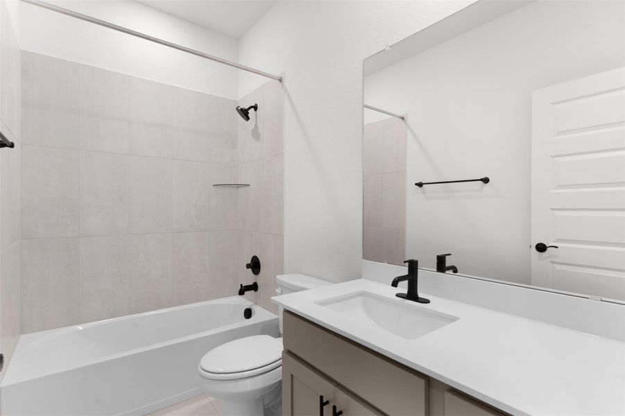 Full bathroom featuring  shower combination and vanity
