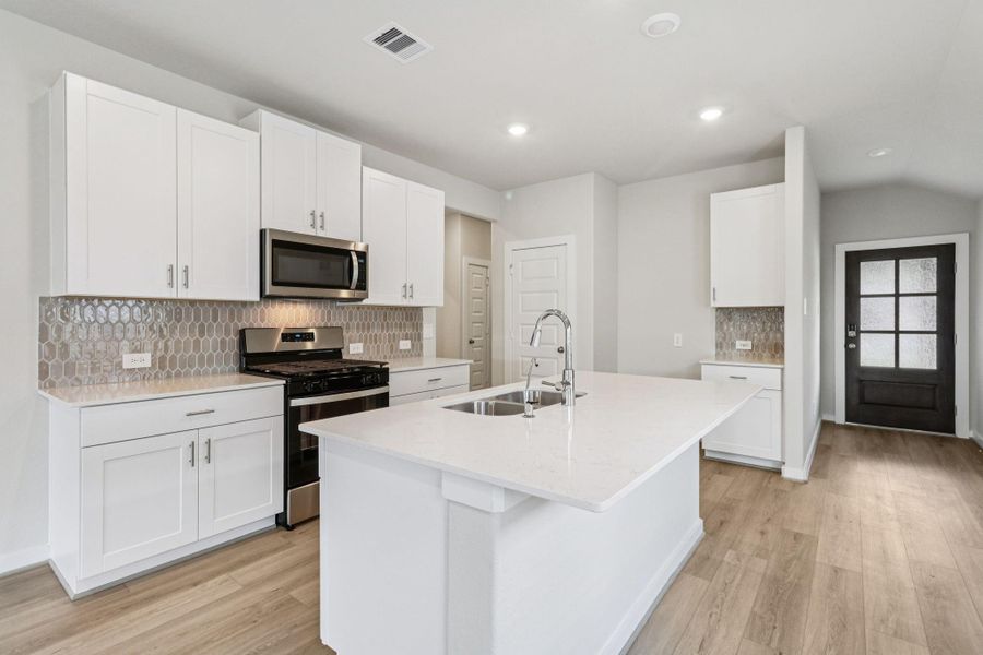 Furnished interior view inside a new home in Landing Meadows - Traditional Series, New Caney (Image 7). Furnished interior view inside a new home in Landing Meadows - Traditional Series, New Caney (Image 7).