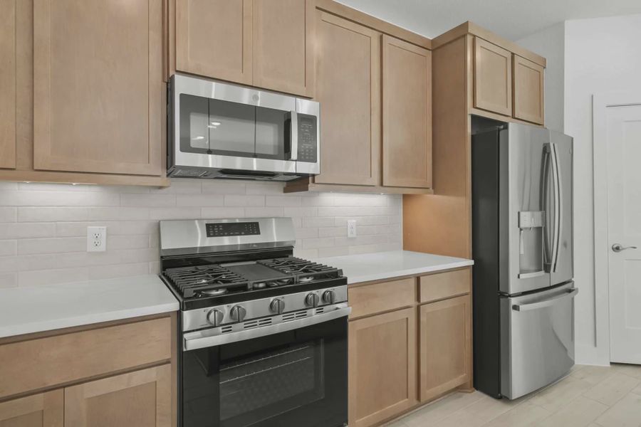 Representative furnished interior of a home built from the Chalet by Chesmar Homes in Meridiana Townhomes, Iowa Colony (Image 8).