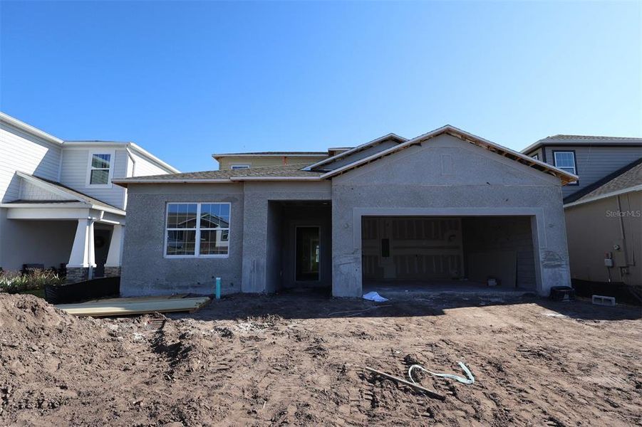 In-progress construction of a new home in Eden at Crossprairie, St. Cloud, FL (Image 9).
