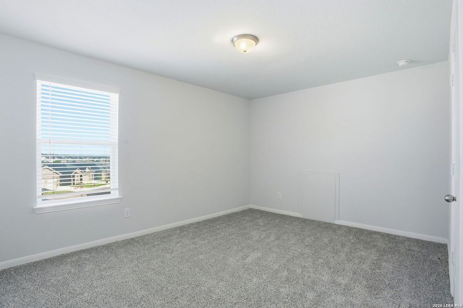 Spacious, unfurnished interior of a new home in Hunter's Ranch, San Antonio (Image 24).