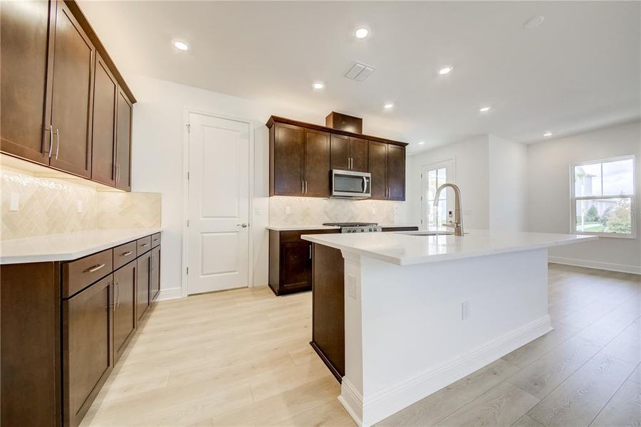 Furnished interior view inside a new home in Bungalow Walk at Lakewood Ranch, Sarasota (Image 9).