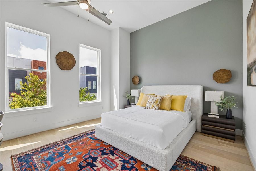 Primary suite has large windows and high ceilings. Primary suite has large windows and high ceilings.