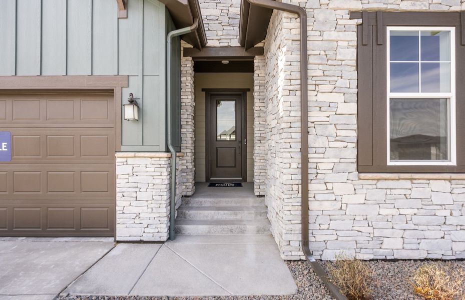 Exterior details and patio area of a home in Hilltop at Inspiration, Aurora (Image 3).