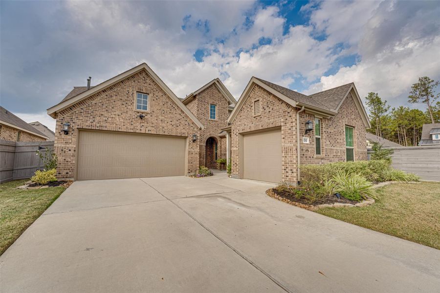Front exterior of a new home in ARTAVIA: Fairway Collection, Conroe, TX, highlighting curb appeal (Image 2).