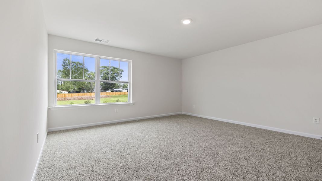 Spacious, unfurnished interior of a new home in Bentley Park, Greenwood (Image 27).