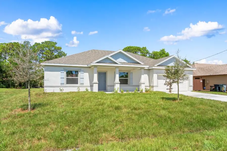 Representative exterior photo of a completed home built from the Delray by Holiday Builders in Palm Bay, Palm Bay, FL (Image 11).