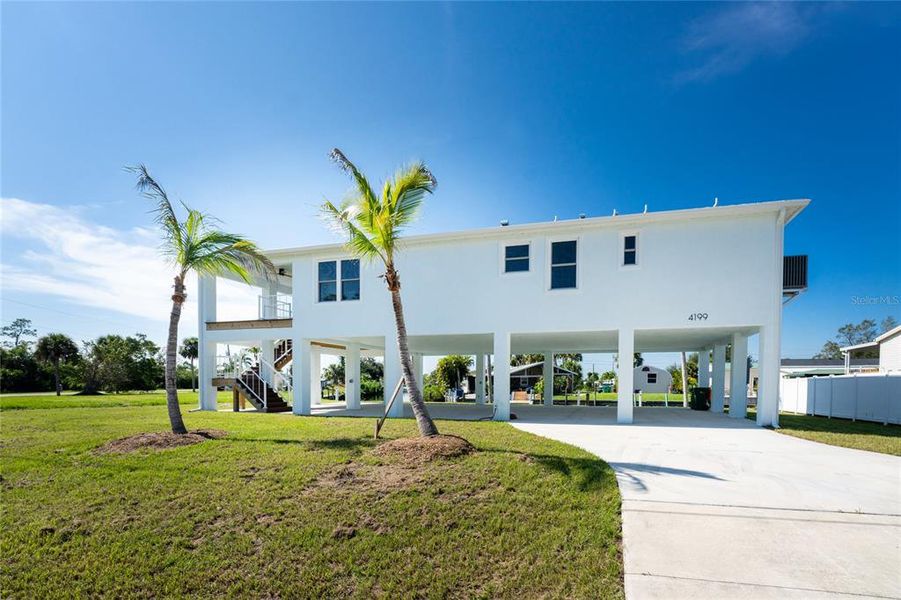 Front exterior of a new home in , Port Charlotte, FL, highlighting curb appeal (Image 24). Front exterior of a new home in , Port Charlotte, FL, highlighting curb appeal (Image 24).
