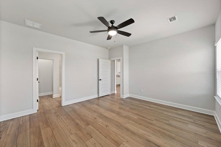 Spacious, unfurnished interior of a new home in Whisper Valley, Manor (Image 12).