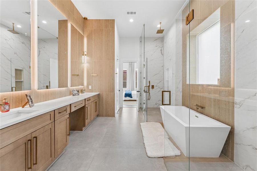 Showstopping primary bathroom with dual showers, vanities and toilet rooms Showstopping primary bathroom with dual showers, vanities and toilet rooms