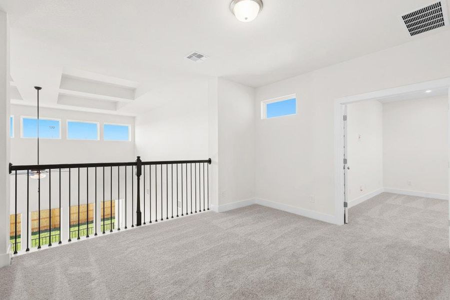 Empty room with light colored carpet and baseboards Empty room with light colored carpet and baseboards