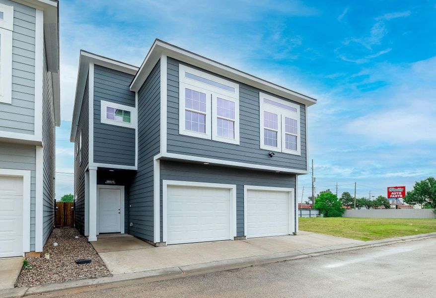 Front exterior of a new home in , Spring, TX, highlighting curb appeal (Image 1). Front exterior of a new home in , Spring, TX, highlighting curb appeal (Image 1).
