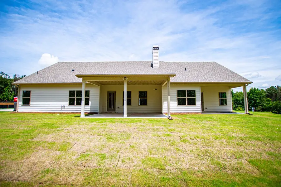 Exterior details and patio area of a home in WOODMONT RESERVE, Roopville (Image 4).