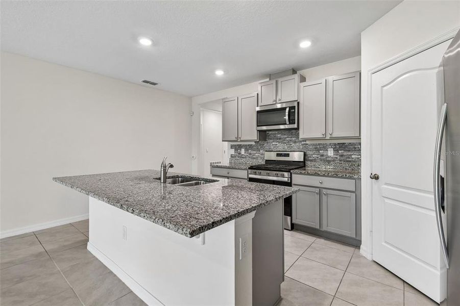 Furnished interior view inside a new home in Riviera Bella, Debary (Image 7).