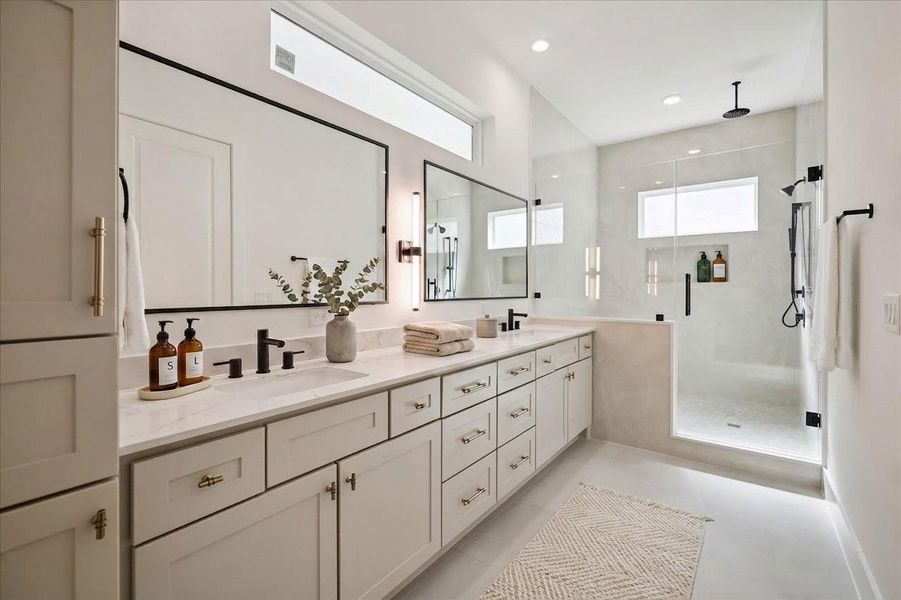 You’re stunning primary suite bathroom has beautiful Kentmore cabinets with gold handles, and a wet room which Riverway likes to call Their signature super shower. Your shower and freestanding tub are all in one..