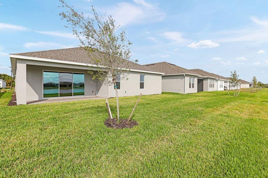 Exterior details and patio area of a home in The Cove at West Port, Port Charlotte (Image 4).