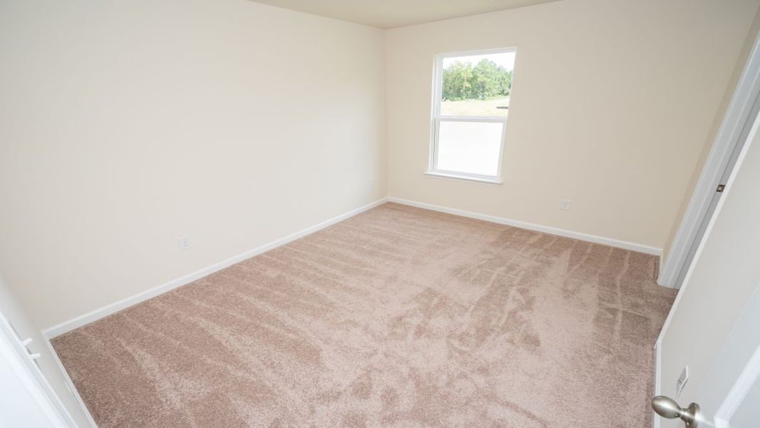 Spacious, unfurnished interior of a new home in The Pines at Blake Farm, Wilmington (Image 28).
