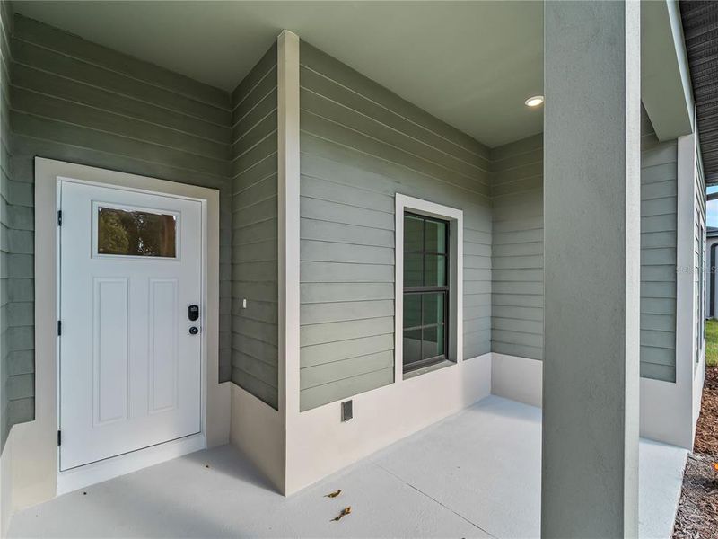Exterior details and patio area of a home in , North Port (Image 36).