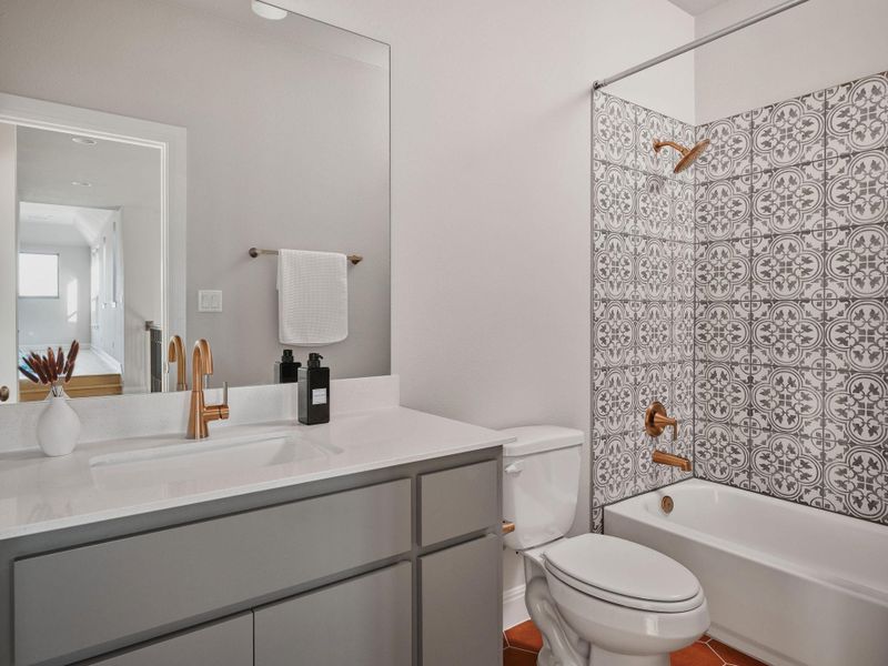 A full bath is located just outside the door of bedroom 5.