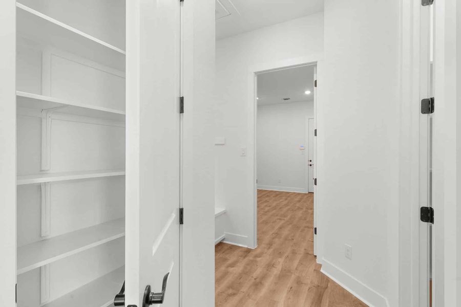 Spacious, unfurnished interior of a new home in The Grove at Blackhawk, Pflugerville (Image 28).