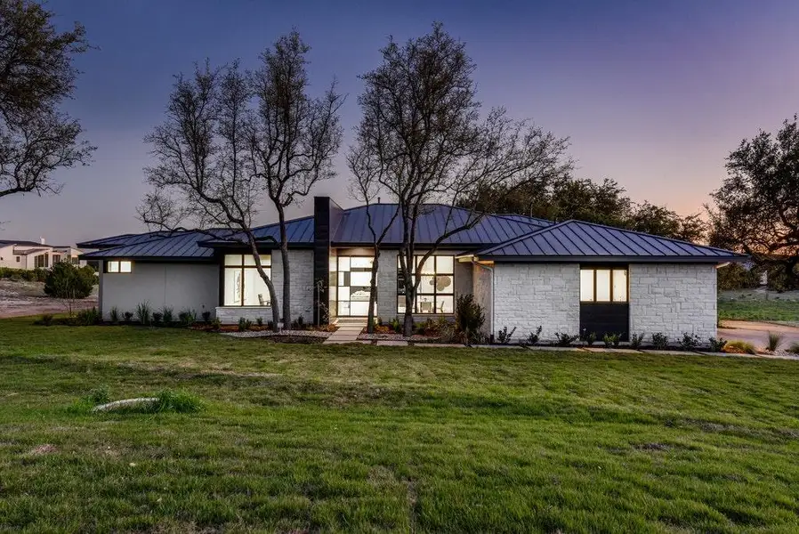 Front exterior of a new home in , Dripping Springs, TX, highlighting curb appeal (Image 1). Front exterior of a new home in , Dripping Springs, TX, highlighting curb appeal (Image 1).