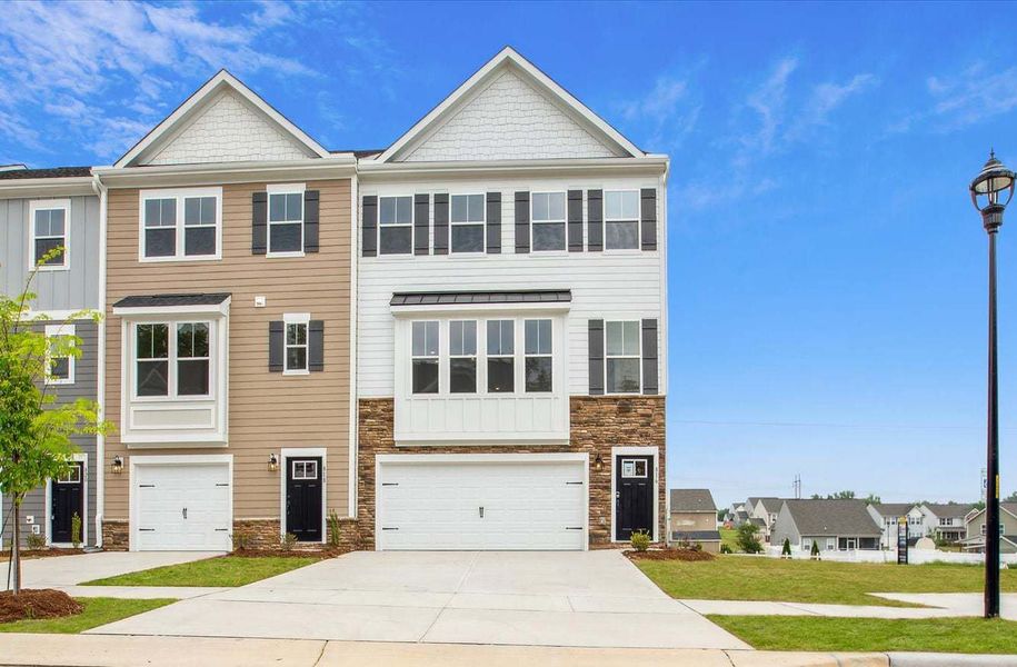 Front exterior of a new home in The Parc Townes at Wendell, Wendell, NC, highlighting curb appeal (Image 2). Front exterior of a new home in The Parc Townes at Wendell, Wendell, NC, highlighting curb appeal (Image 2).