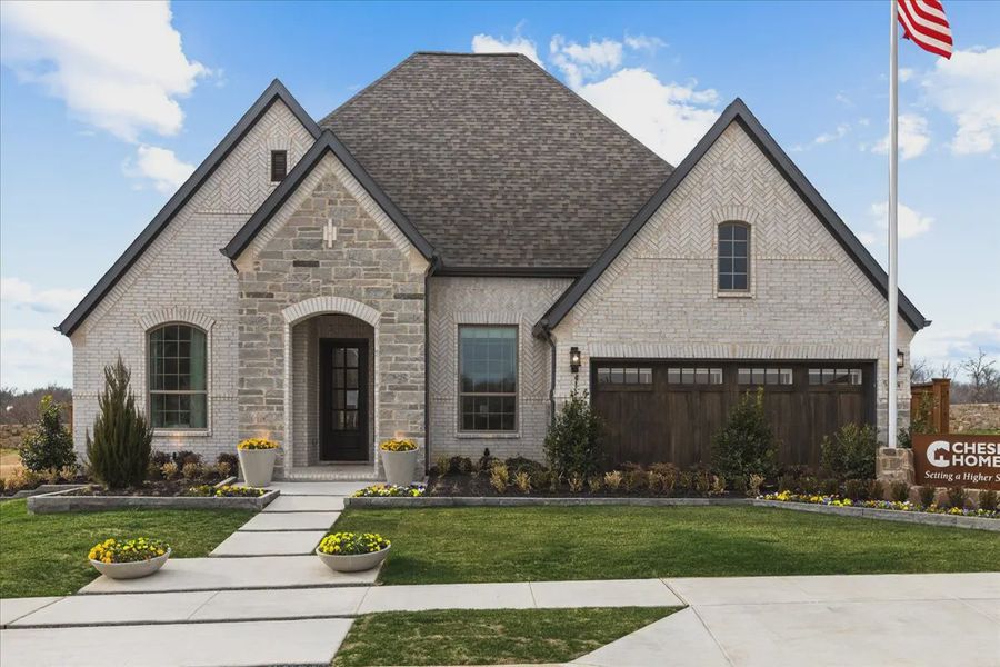 Front exterior of a new home in Canyon Falls, Northlake, TX, highlighting curb appeal (Image 2). Front exterior of a new home in Canyon Falls, Northlake, TX, highlighting curb appeal (Image 2).