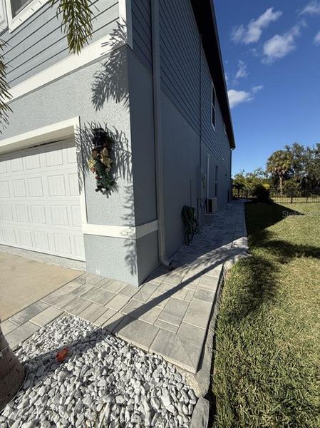 Exterior details and patio area of a home in Isles at BayView, Parrish (Image 24).