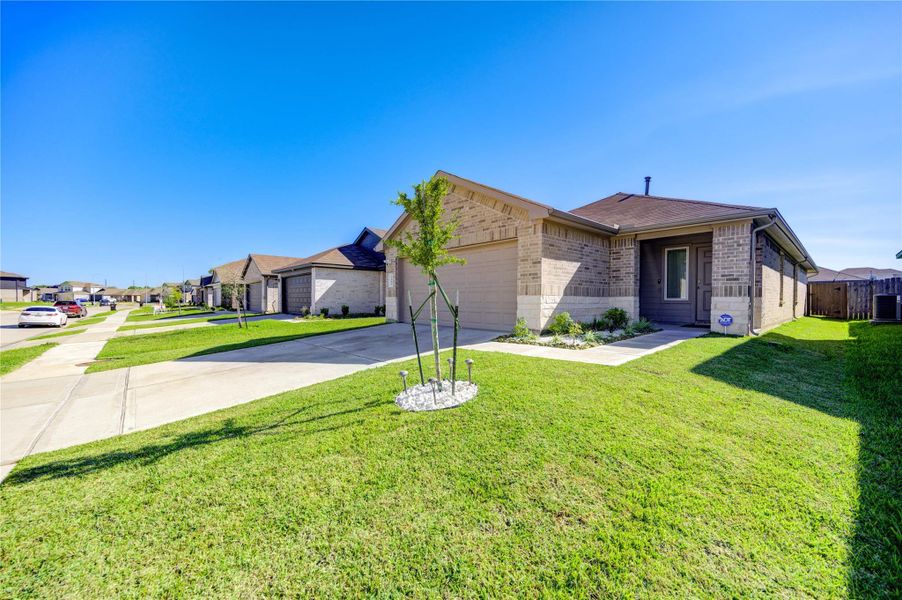 Front exterior of a new home in Breckenridge Forest, Spring, TX, highlighting curb appeal (Image 1).