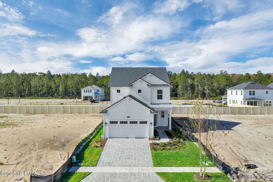 Front exterior of a new home in Seabrook Village at Seabrook, Ponte Vedra, FL, highlighting curb appeal (Image 22).
