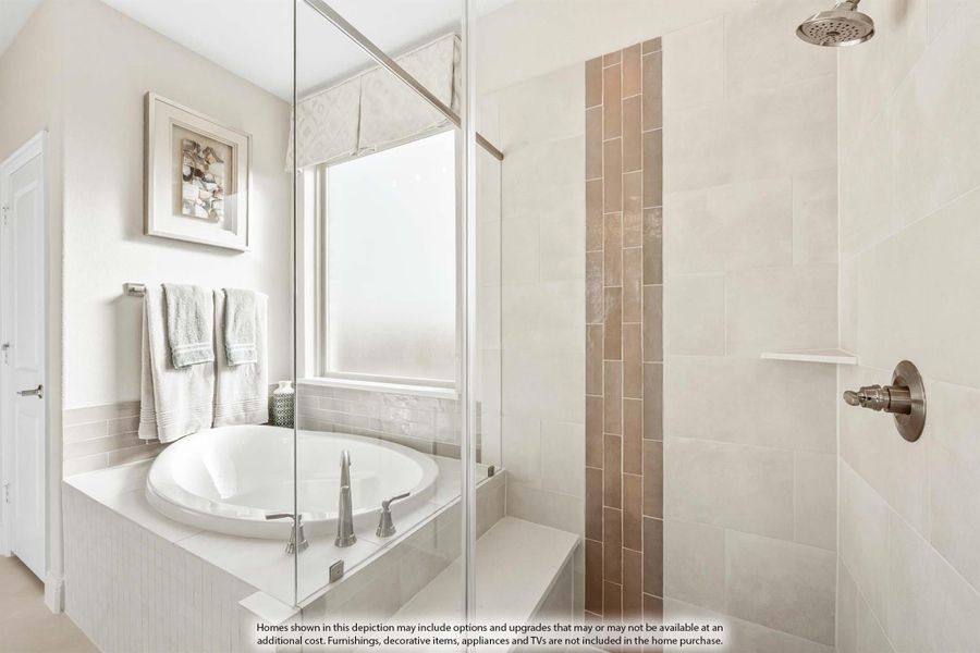 Bathroom with oval soaking tub and glass-enclosed walk-in shower with tile walls and bench seat