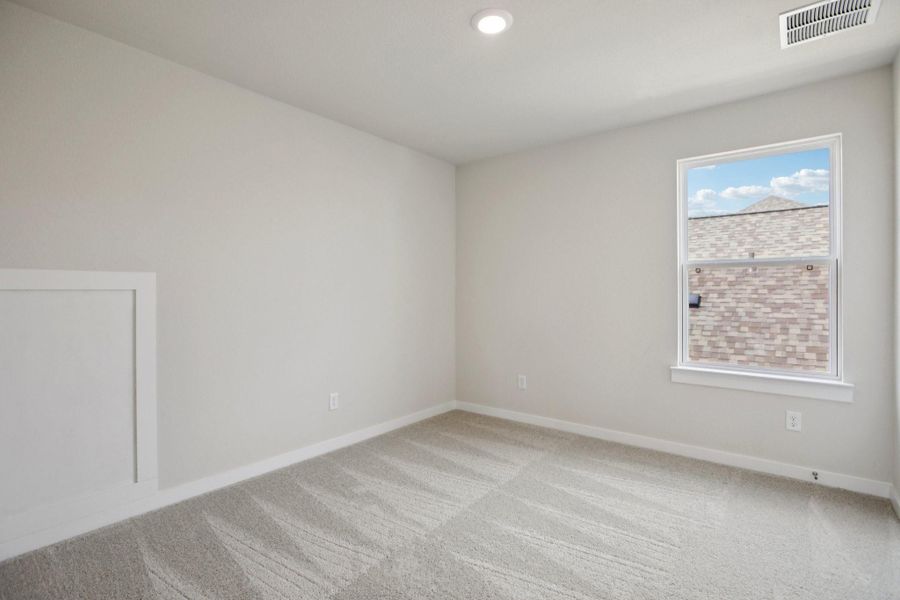 Carpeted spare room with baseboards and recessed lighting