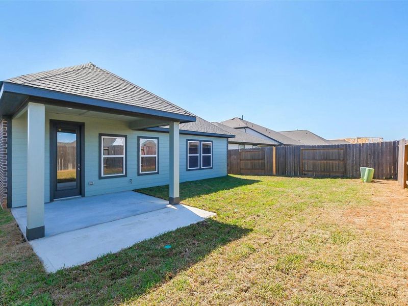 Exterior details and patio area of a home in Sunterra, Katy (Image 23).