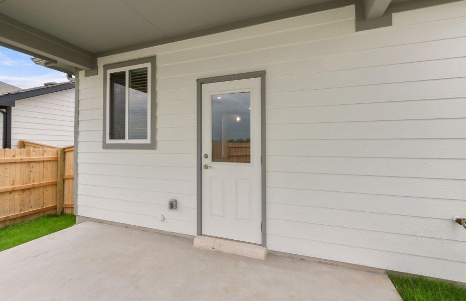 Front exterior of a new home in Patterson Ranch, Georgetown, TX, highlighting curb appeal (Image 23). Front exterior of a new home in Patterson Ranch, Georgetown, TX, highlighting curb appeal (Image 23).