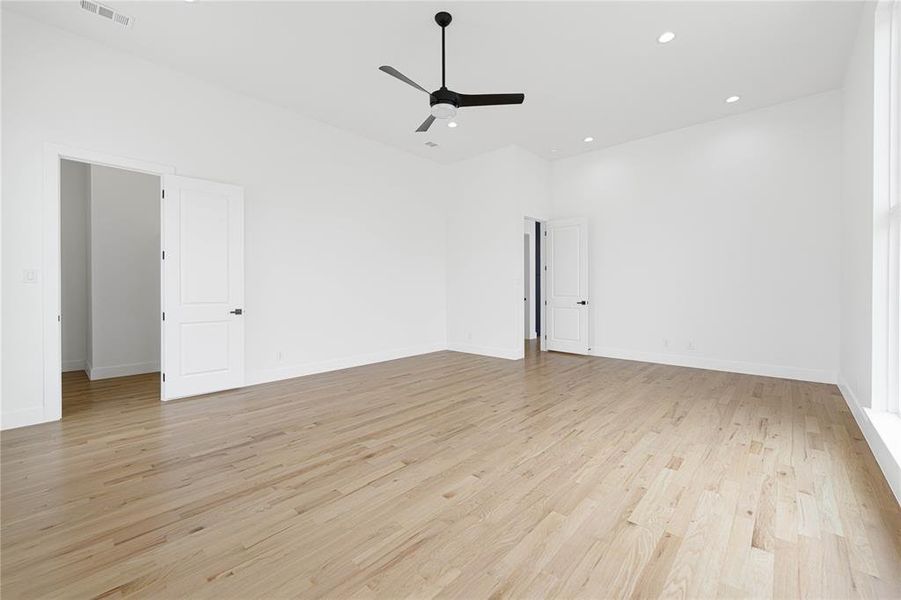 Empty room with ceiling fan, recessed lighting, and light wood-style flooring