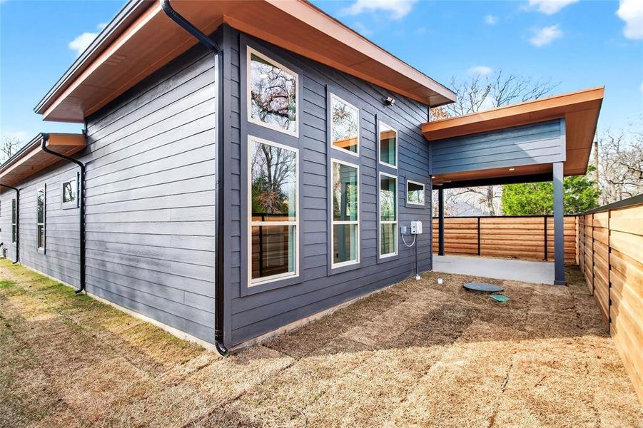 View of side of property with a fenced backyard and a patio View of side of property with a fenced backyard and a patio