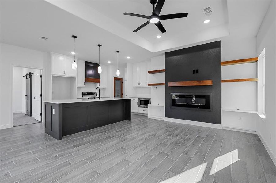 Open kitchen and living room with fireplace