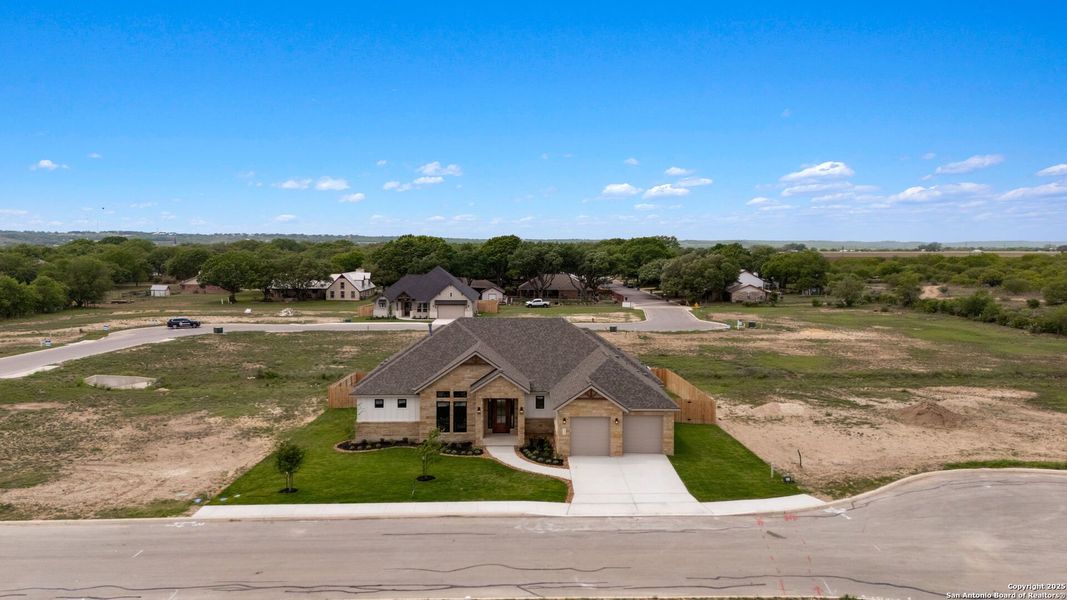 Front exterior of a new home in , Castroville, TX, highlighting curb appeal (Image 28). Front exterior of a new home in , Castroville, TX, highlighting curb appeal (Image 28).