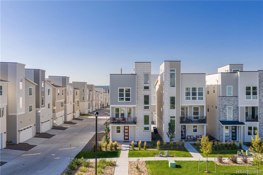 Front exterior of a new home in Haskins Station, Arvada, CO, highlighting curb appeal (Image 21). Front exterior of a new home in Haskins Station, Arvada, CO, highlighting curb appeal (Image 21).