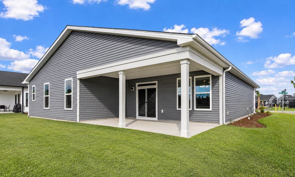 Exterior details and patio area of a home in Traditions at Carolina Forest, Myrtle Beach (Image 3).