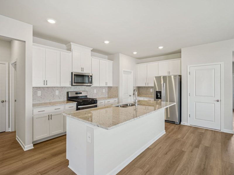 Furnished interior view inside a new home in Northwoods at Mirror Lake, Villa Rica (Image 6).