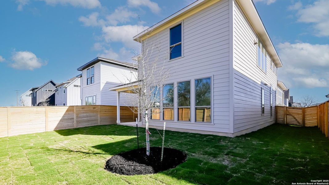 Front exterior of a new home in Solms Landing 45', New Braunfels, TX, highlighting curb appeal (Image 21).