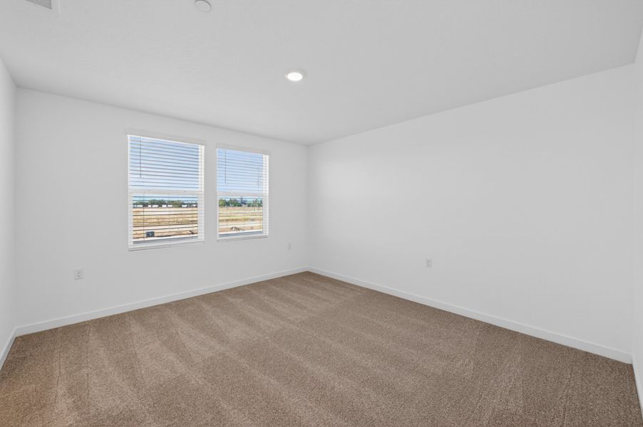 A room with a carpet and a rug. A room with a carpet and a rug.