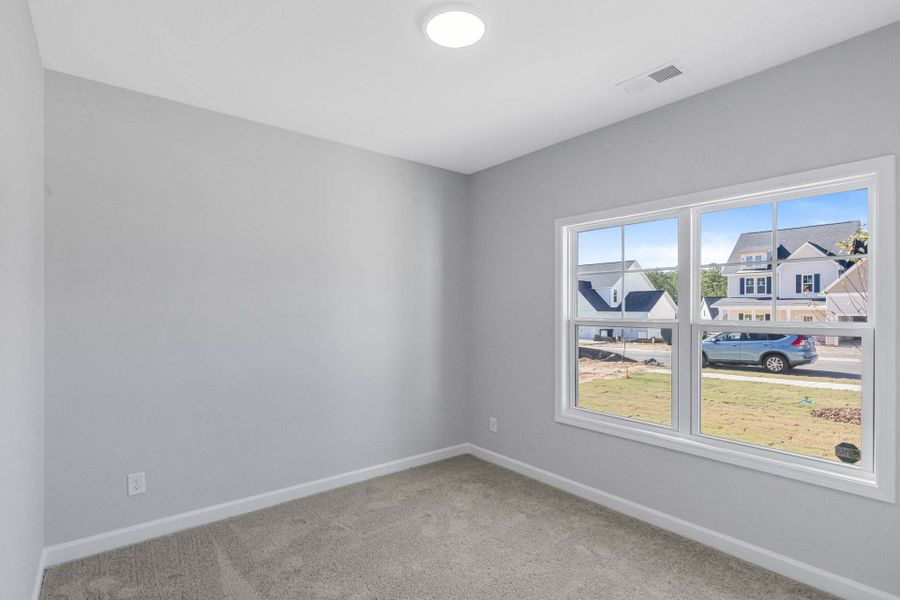 Representative unfurnished interior of a home built from the Weymouth by Caviness & Cates Communities in Bartlett Manor, Youngsville (Image 97).