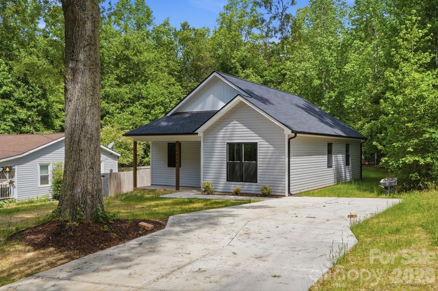 Front exterior of a new home in , Statesville, NC, highlighting curb appeal (Image 24).