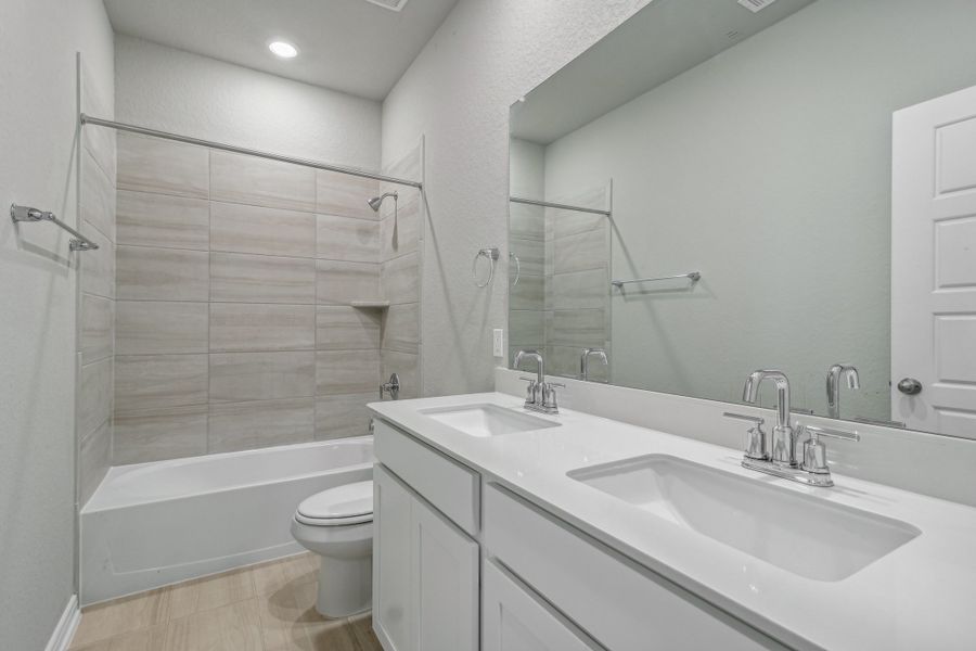 Guest bathroom in the Allen floorplan at a Meritage Homes community. Guest bathroom in the Allen floorplan at a Meritage Homes community.