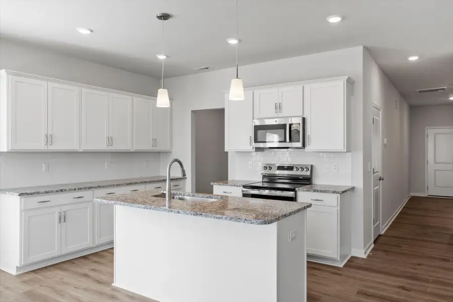 Furnished interior view inside a new home in West Main Townhomes, Sanford (Image 5).