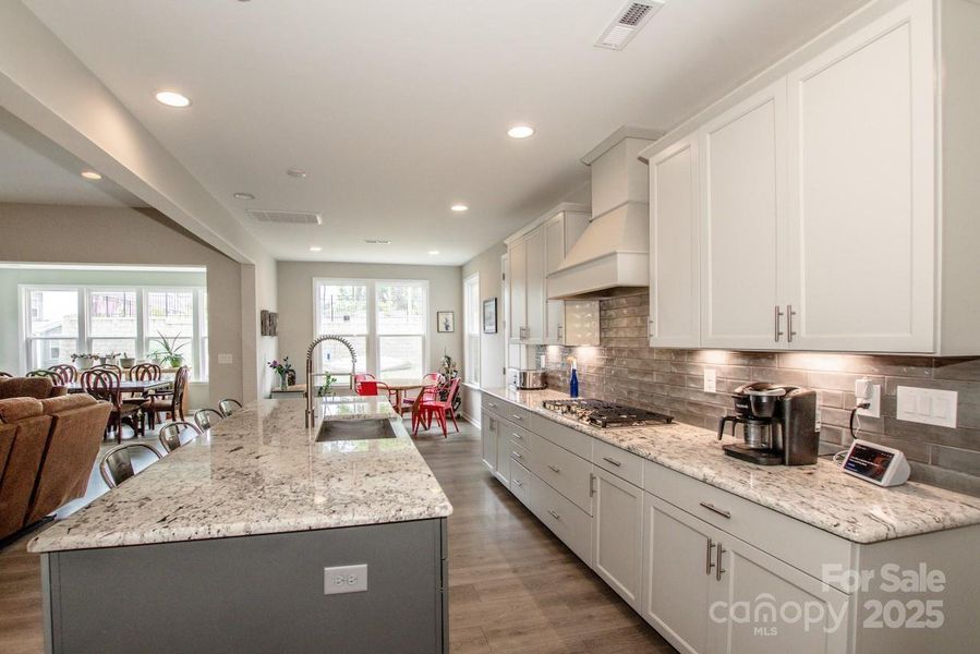 Furnished interior view inside a new home in Signature at Reid's Cove, Mooresville (Image 6).