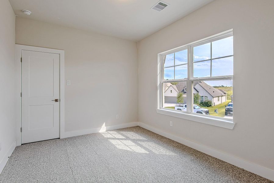 This secondary bedroom is bright, inviting, and versatile This secondary bedroom is bright, inviting, and versatile
